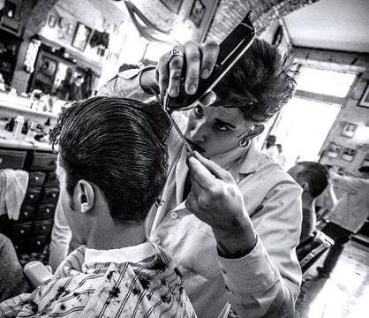 Barber is making haircut
